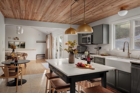 Spacious kitchen and dining area with seating for 18–20 to cook and gather.