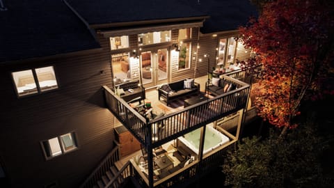 Relax on the two-level deck with hot tub, fire pit, and seating for cozy nights.