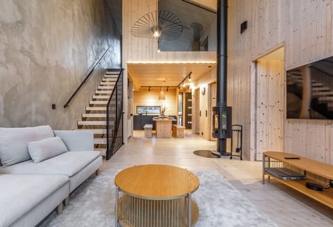 Deluxe Villa, Courtyard View | Living area | Flat-screen TV, fireplace