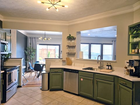 Prep and cook with ease in the fully equipped kitchen with modern appliances, plenty of counter space, & everything you need to feel at home. Plenty of space for the whole group!