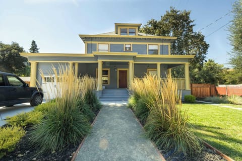 Welcome home to this charming craftsman-style retreat featuring a spacious front porch, lush landscaping, and inviting curb appeal that sets the tone for a warm and comfortable stay