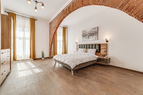 Apartment, 2 Bedrooms, Balcony | Desk, laptop workspace, iron/ironing board, free cribs/infant beds
