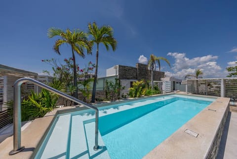 Relax by the rooftop pool with stunning views.