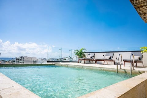 Relax by the rooftop pool with stunning views.