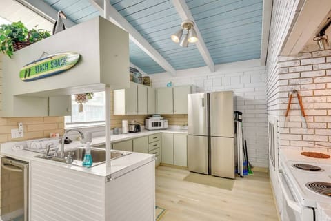 It may be quirky, and perfectly imperfect, but this fun vintage kitchen still holds all the modern amenities one could need, and a large stainless fridge with icemaker for all your refreshments.