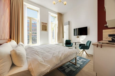 Deluxe Studio, City View | In-room safe, blackout drapes, soundproofing, iron/ironing board