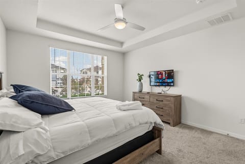 Step into the master bedroom, a private retreat with a king bed, wide windows, and a serene atmosphere to wake up refreshed.
