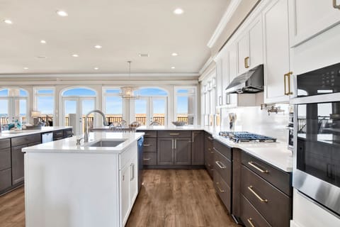 Newly remodeled kitchen with stone counters and stainless appliances