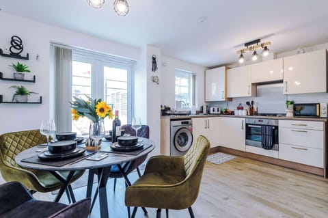 The bright and spacious kitchen has everything you could possibly need to cook during your stay. To name a few, there is a microwave, toaster, kettle, oven and washing machine plus a dining area that seats 4.