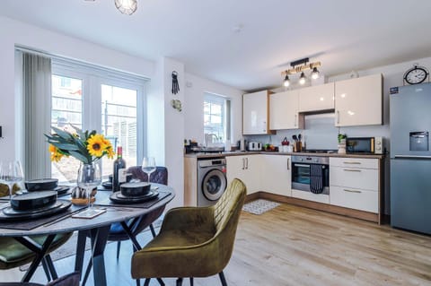 The bright and spacious kitchen has everything you could possibly need to cook during your stay. To name a few, there is a microwave, toaster, kettle, oven and washing machine plus a dining area that seats 4.