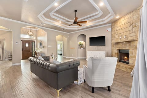 Living Room: Elegant lounge with stylish décor, cozy fireplace, and a bright, welcoming vibe—ideal for short term rental guests in Harker Heights TX near Fort Hood.