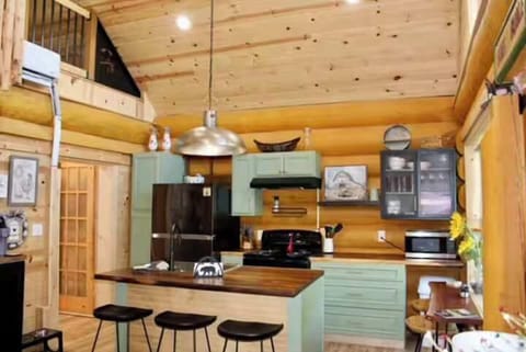 Fully equipped kitchen for your cooking needs- full size refrigerator, electric stove, dishwasher, cookware, small appliances, Whether you want to whip up a quick meal or prepare a full feast. 