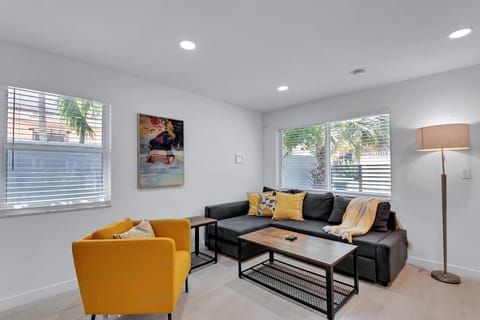 Bright and inviting living space with a smart TV and cozy seating—ideal for downtime or movie nights.