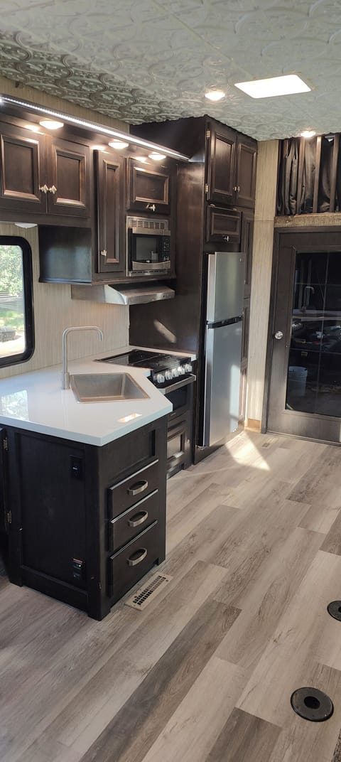 view of the kitchen and the door going to the secound bedroom 