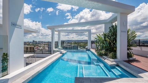 Take a refreshing dip in the rooftop infinity-edge pool.