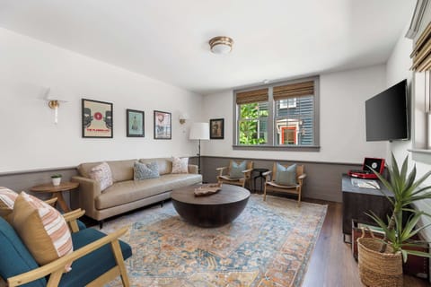 Spacious living room with seating for your entire group + TV!