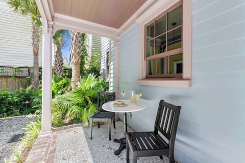 Outdoor seating surrounded by palm trees and sunshine. Welcome to your downtown escape. 