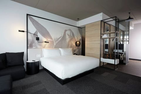 Stretch out on crisp linens beneath warm designer lighting.