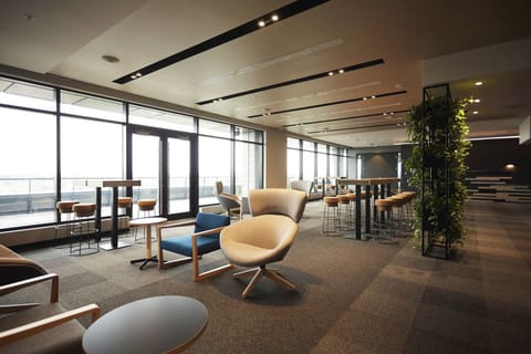 Unwind in the sunlit lounge with sweeping window views.