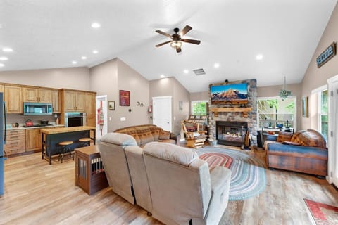 Charming living space with a glowing fireplace.