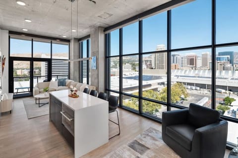 12` Floor to ceiling glass with stunning views of Downtown SLC and the Mountains! Watch the storms roll in!!