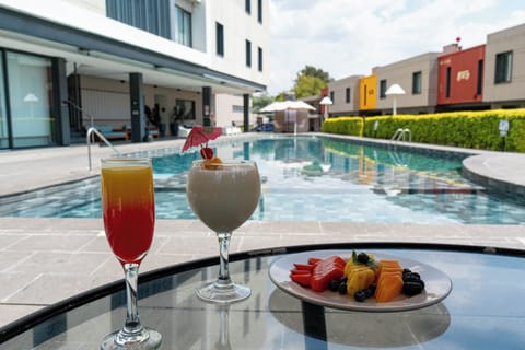 Outdoor pool, open 9:00 AM to 8:00 PM, pool umbrellas, sun loungers