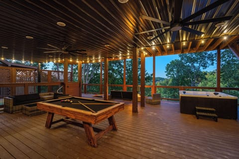 Ultimate deck with pool, games, bar, firepit & cozy seating