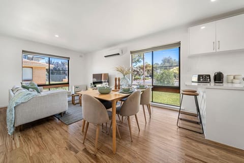 Seamless open plan living invites you to come together for shared meals or movie nights at home.