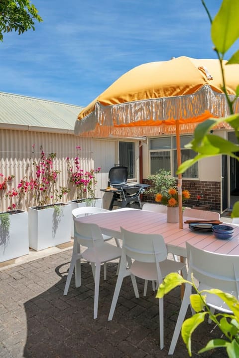 Fire up the barbecue and enjoy open-air meals under the umbrella as the evening breeze rolls through.