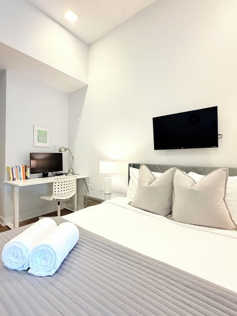 A warm and tasteful bedroom where soft light invites peaceful relaxation.