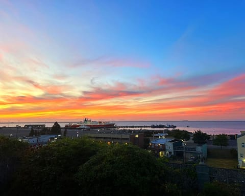 Brilliant sunsets light up the sky each evening, painting the harbor in fiery oranges, soft pinks, and deep purples—best enjoyed right from your deck.