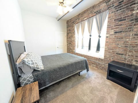 This queen-sized bedroom offers the perfect retreat for relaxation and comfort.