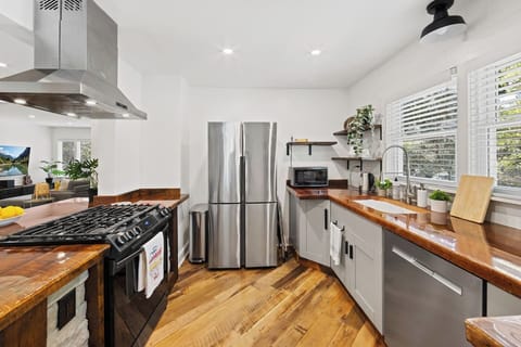 Lots of counter space for cooking family meals.  Kitchen features; - Large single-basin farmhouse sink- Coffee Maker- Electric Hot Water Kettle- Microwave- Toaster- Large Air Fryer- Instant Pot- Pots/Pans/utensils- Cutting board/Knives