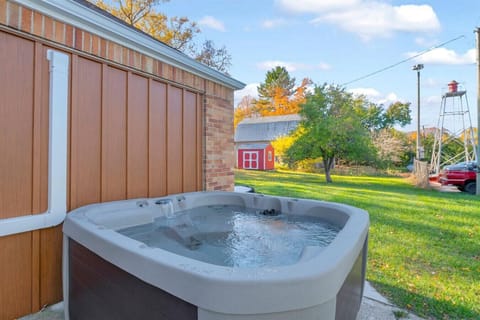 Relax in the private hot tub while enjoying peaceful small-town views.