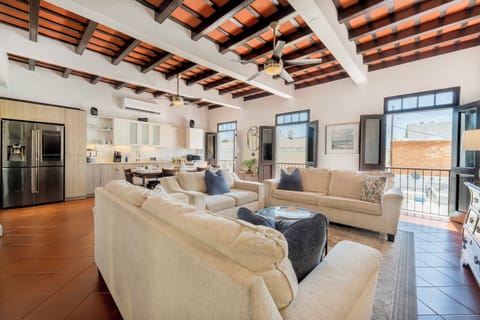 Expansive open living room with soaring ceilings & abundant natural light.