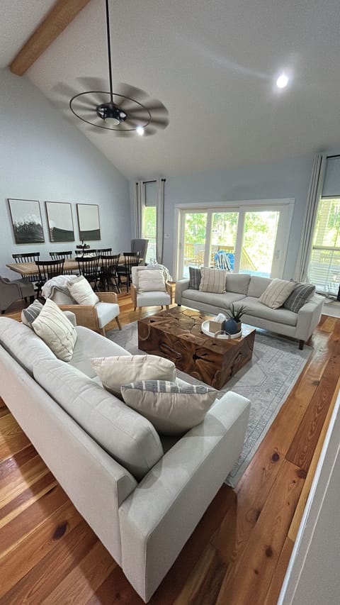 Den and dining area with access to back deck