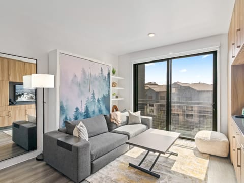 Studio living area with queen Murphy bed