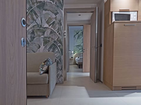 Deluxe Condo, 2 Bedrooms | Living area | Flat-screen TV