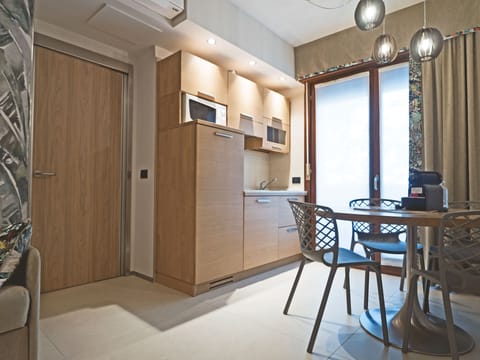 Deluxe Condo, 2 Bedrooms | Private kitchen | Fridge, microwave, stovetop, dishwasher