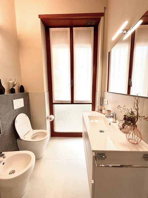 Shower, hair dryer, slippers, towels