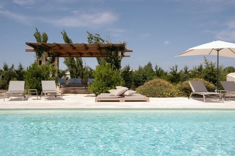 The shady al fresco sitting area by the pool.