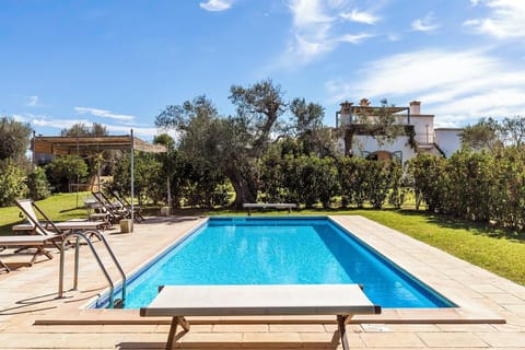 A shot of the lovely pool with the house in the background.