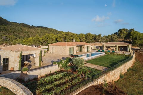 Estrella, its pool, gardens and terraces bathed in soft, late afternoon sunlight.