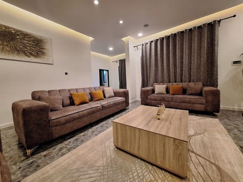 Deluxe Apartment, Balcony, City View | Living area | Flat-screen TV