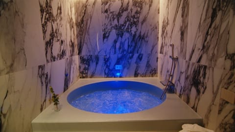 Junior Suite, 1 King Bed with Sofa bed | Bathroom | Hair dryer, slippers, bidet, towels