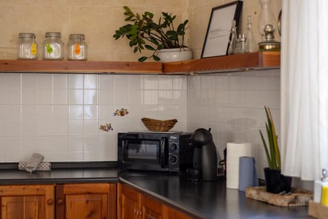 Well-appointed kitchen featuring all the essentials and charming details to make you feel at home.