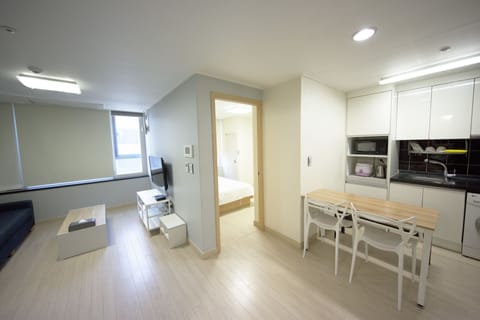 Family Suite (with Kitchen and Washing Machine) | Living area | TV
