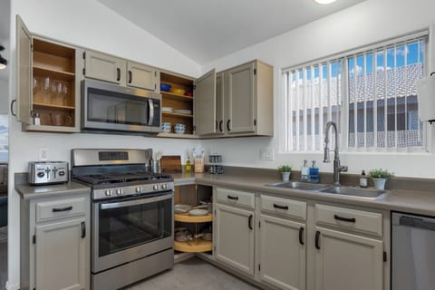 Ample dinnerware, cups, wine glasses, plasticware, cookware and bakeware.