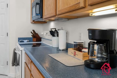 Start your day right with a fresh brew from the fully equipped kitchen coffee station.