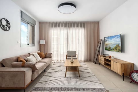 Bright living space with comfortable seating, natural light, and relaxing atmosphere exactly as beautifully advertised online.